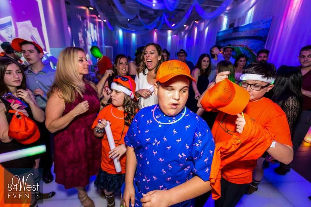 kids in orange at event