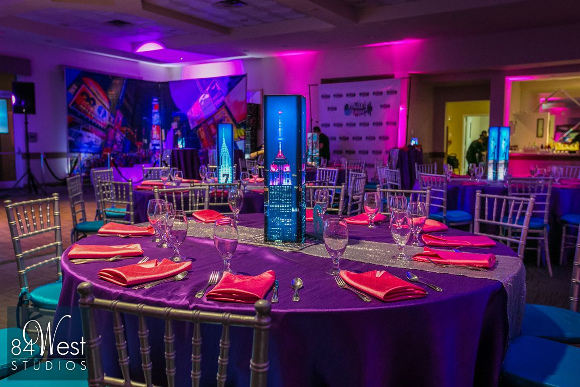 event table with Empire State Building decor in purple, pink, and tiffany blue