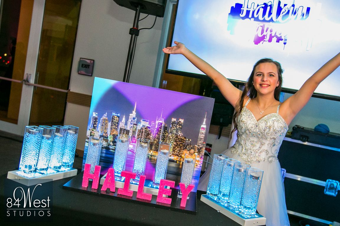 Bat Mitzvah girl with custom NYC skyline candle lighting