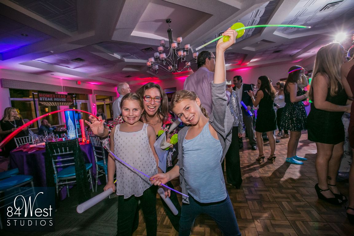 Partying kids with glow sticks