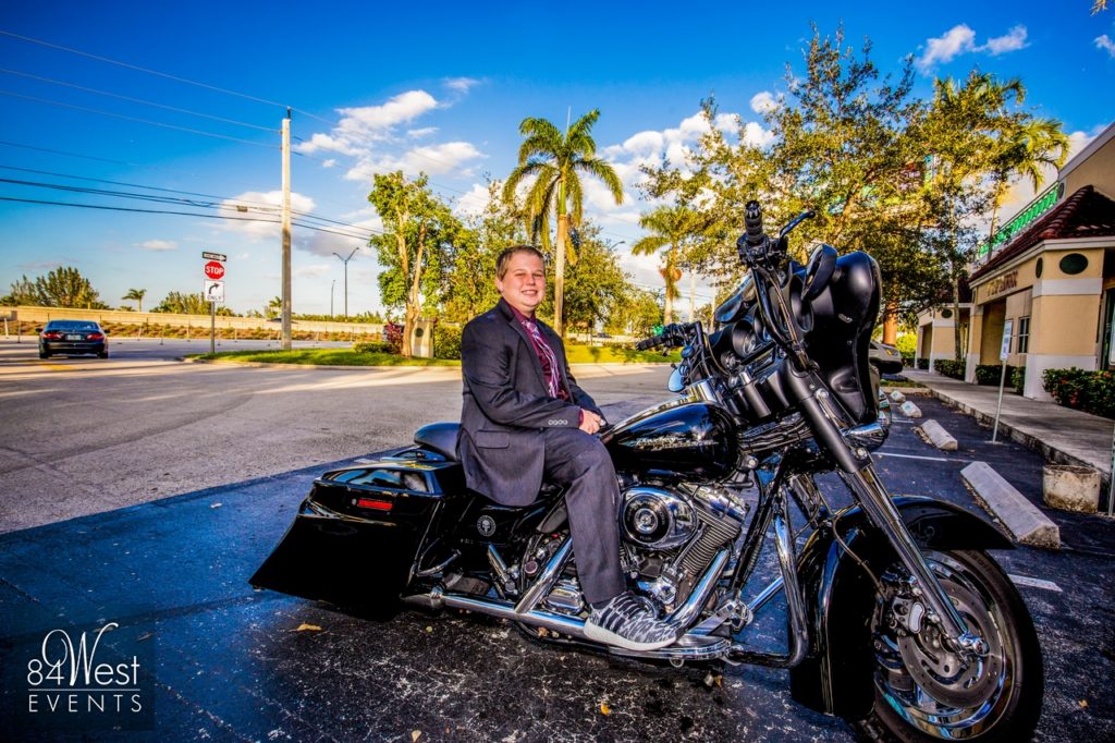 boy posing on motorcycle