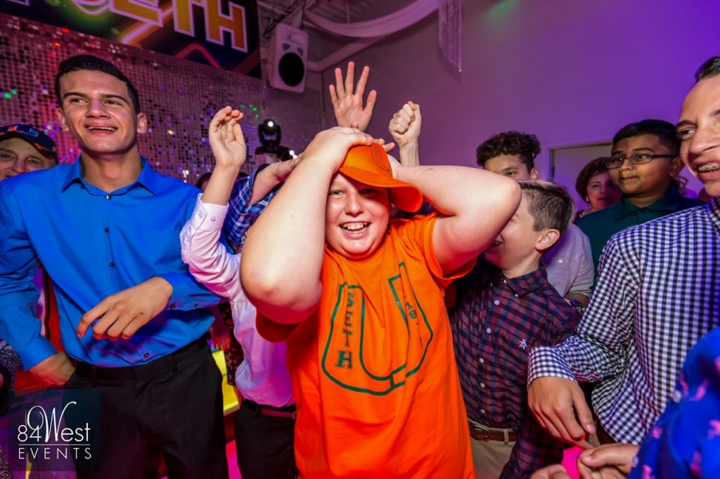 child in orange shirt