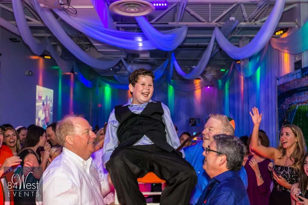 bar mitzvah guest in chair